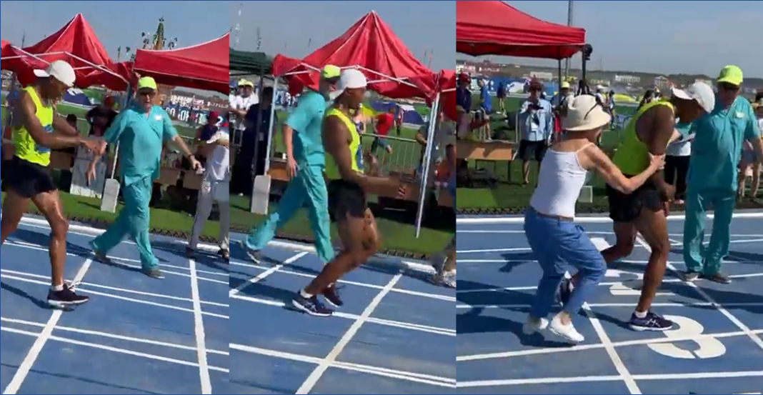 A punto del desmayo en la meta, mamá lo ayuda y lo descalifican